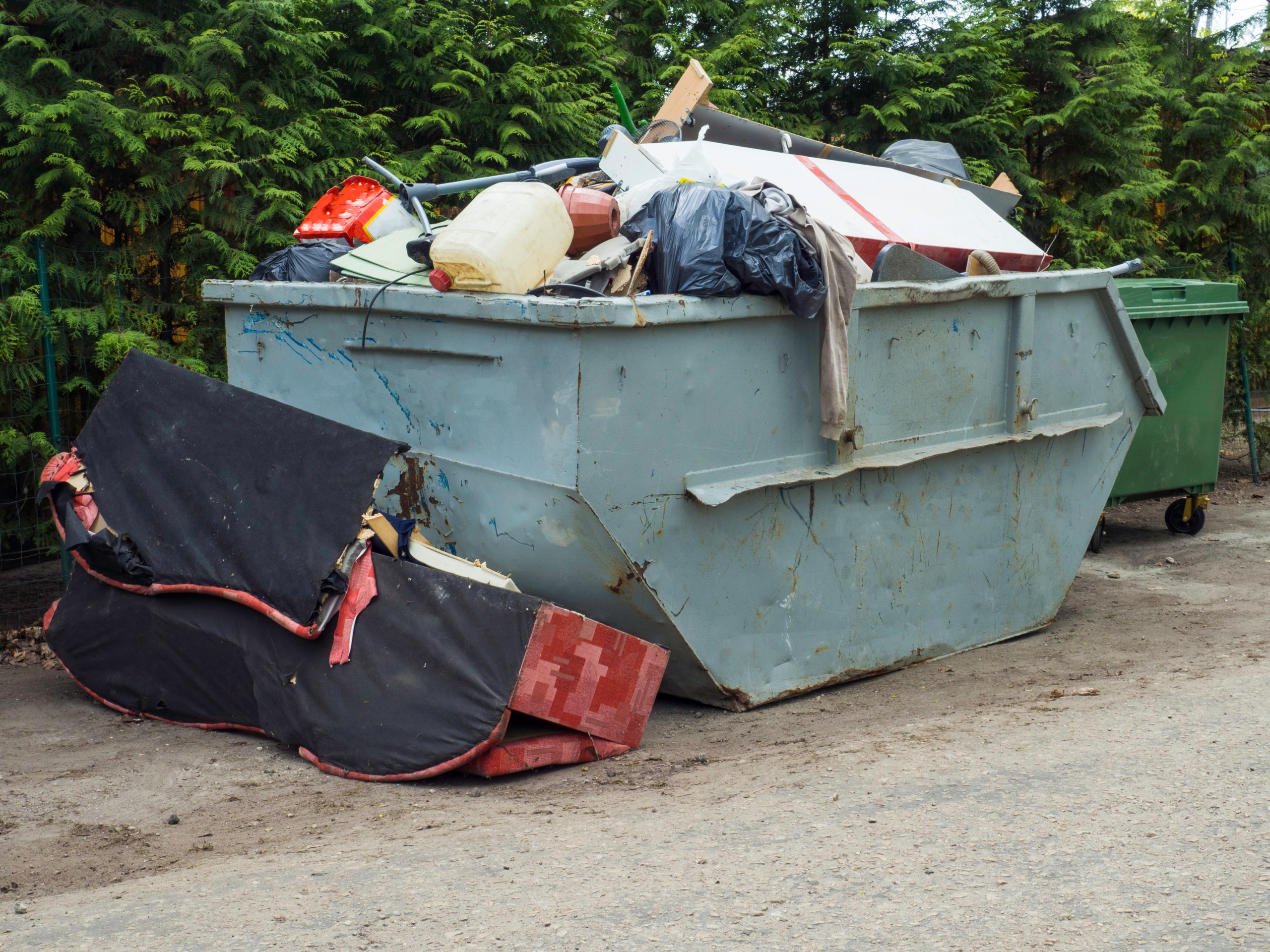 Loaded dumpster filled with rubble dumpster, recycle, waste and garbage